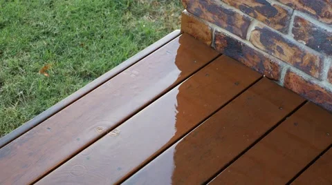 4k Rain Falling on Wooden Deck Stock Footage 40322837