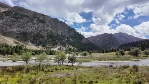 4K Rainforest Valley Breathtaking Mountain Range with River, Lush Green Land Stock Footage 287997657
