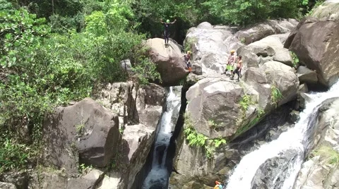 4K Rainforest Waterfall Jump Flip Stock Footage 63618117
