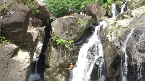 4K Rainforest Waterfall Jump  Stock Footage 63618118