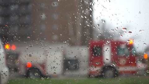4K Rainy Car Window Rolling Down To Reveal Flashing Lights Red Firetruck Stock Footage 89248879