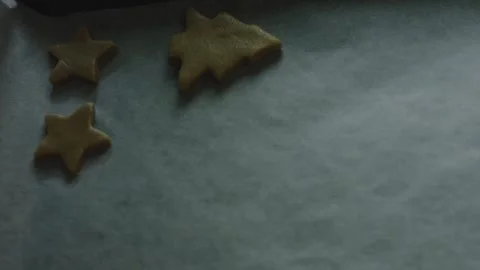 4K Raw Star-shaped Cookie Placed on a Parchment Baking Sheet Stock Footage 342113429