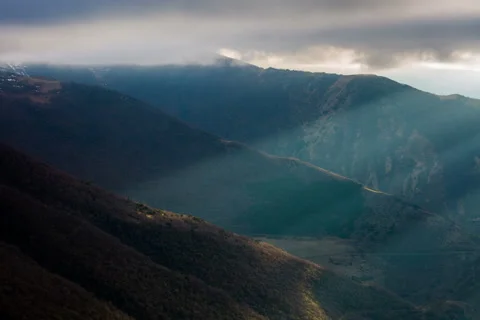 4k. A ray of sun and clouds in the mountains. Stock Footage 50873004