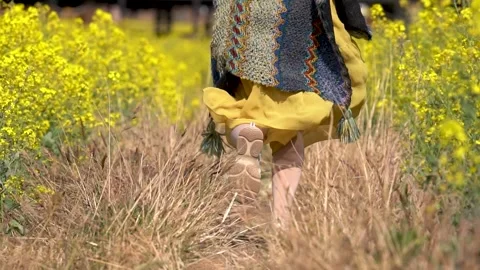 4K real shot close-up video of a young girl's footsteps running in the count Stock Footage 334901421