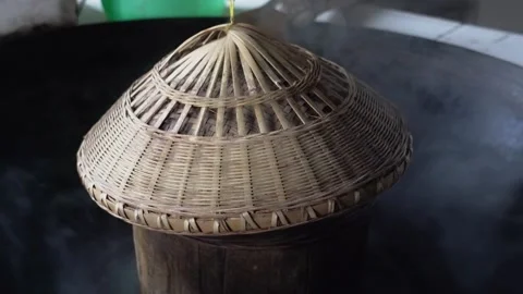 4K Real Shot of Steaming Rice with Bamboo Rain Cape and Corn Rice in Rural Area Video stock 340400578