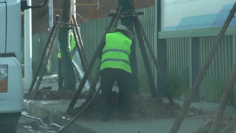 4K Real-shot Video of the Back View of Workers Doing Urban Road Greening Stock-Footage 334597371