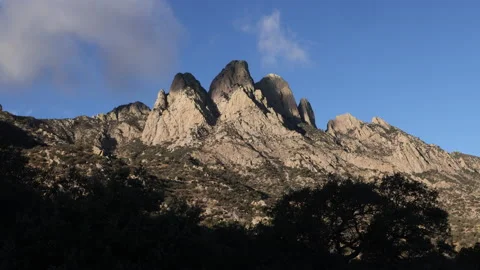 4K real time of approaching Clouds casting shadows on The Organ Mountains Stock Footage 229334581
