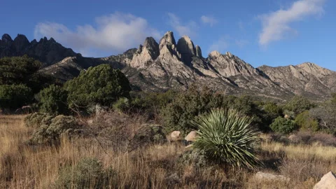 4K real time of approaching sunny Clouds in The Organ Mountains in New Mexico Stock Footage 229312089