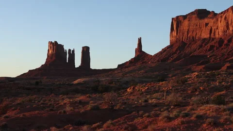 4K Real Time backdrop of Sunrise sunlight on rock formations in Monument Valley Stock Footage 253345216