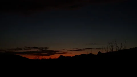 4K Real Time of a dark orange horizon silhouetting Chihuahuan Desert Landscape 스톡 동영상 169613502