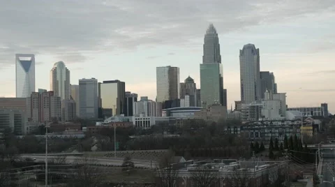 4K real-time downtown Charlotte, NC seen from distance during sunset. Stock Footage