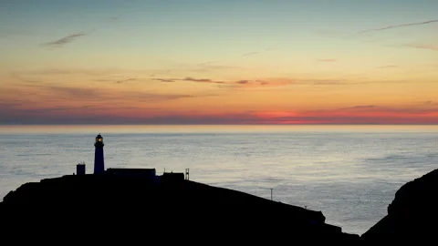 4K real time video of dusk over South Stack lighthouse, Anglesey, North Wales Stock Footage 312876395