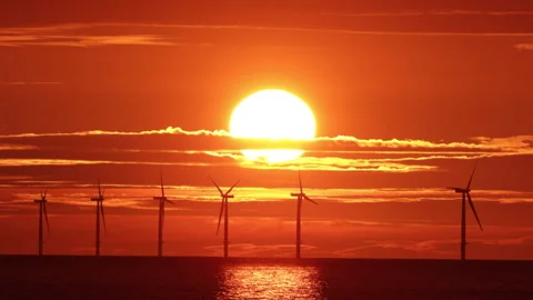 4K real time video of sunset over offshore wind turbines, North Wales Stock Footage 280562589