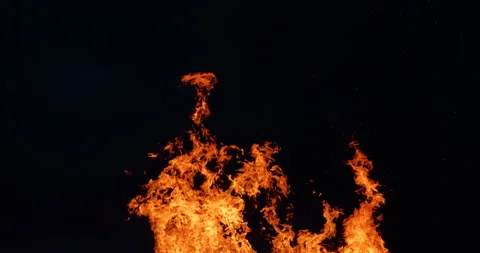 4K - Real tongues of flame from a fire burning at night Stock Footage 280418077