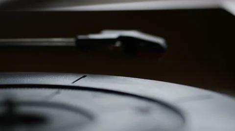 4K Record being placed on a record player and spinning as needle comes down Stock Footage 64208137