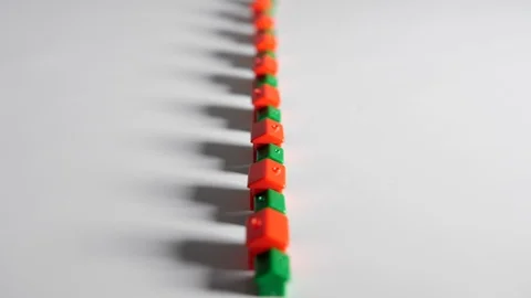 4K Red and green plastic houses in a straight line a long row white background Stock Footage 90806239