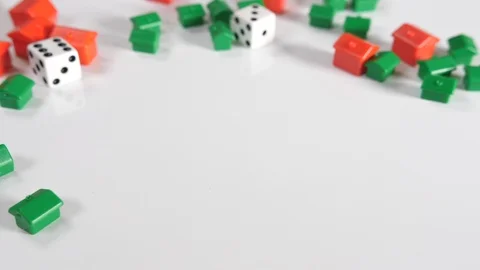 4K red and green toy house shapes on a white surface background with two roll Stock Footage 90809205