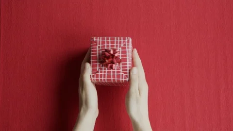 4K Red gift box isolated on red background. Christmas, Valentines day, Birthday. Video stock 121248340