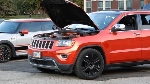4K Red SUV With Transformer Logo with Hood Open showing Engine And Black Whee Stock Footage 89521913
