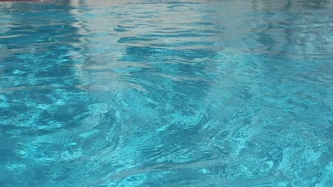 4K Reflection of the sunlight in a clear blue water in swimming pool. Stock Footage 107426830