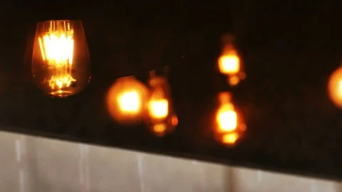 4K reflection of vintage old bulb natural swing from window in coffee shop 動画素材 92549746