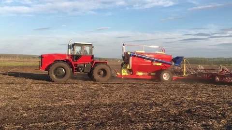 4k resolution. Farmer on the tractor plows and fertilizes the soil Video stock 73599779