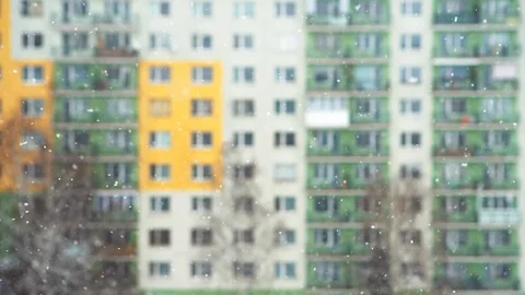 4K resolution footage of snow falling on background of concrete building Stockbeeldmateriaal 101247731