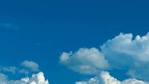 4k resolution. TimeLaps. Beautiful white clouds move through the blue sky Stock Footage