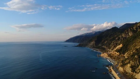 4K resolution video with drone of the sea and mountains at sunset. Stock Footage 100725405