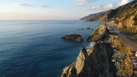 4K resolution video with drone of the sea and mountains at sunset. Stock Footage 100727630