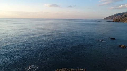 4K resolution video with drone of the sea and mountains at sunset. Stock Footage 100727843