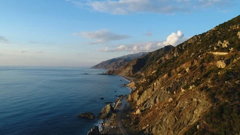 4K resolution video with drone of the sea and mountains at sunset. Stock Footage 100728337