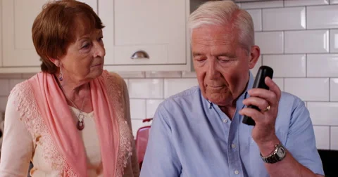 4k, Retired couple talking on phone from home. Stock Footage 67194166