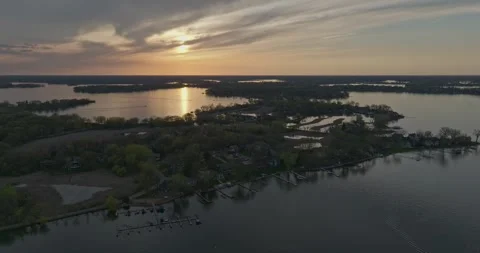 4K Reverse Aerial View of Manitou Rd Area Flooded On Lake Minnetonka at Sunset Stock Footage 247872503