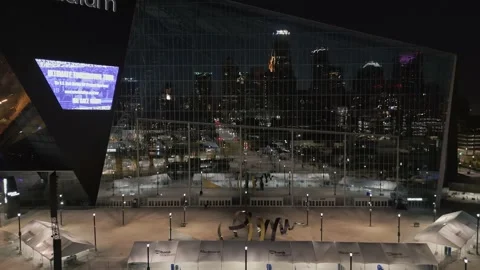 4K Reverse Aerial View Of Minneapolis Skyline Reflection On Stadium At Night Stock Footage 225649401