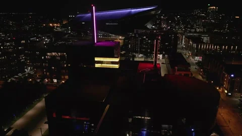 4K Reverse Aerial View Of Stadium Behind Guthrie Theater In Minneapolis At Night Stock Footage 225650179