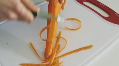 4K - REVERSE carrot peeling Stock Footage 61545479