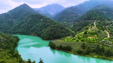 4K reverse drone orbit of turquoise river and forest landscape in mountains Stock Footage 336449856