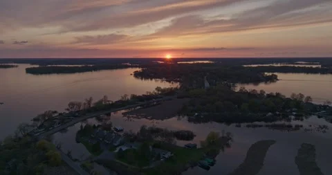 4K Reverse Drone Shot of Manitou Rd Flooded On Lake Minnetonka at Sunset Stock Footage 247875305