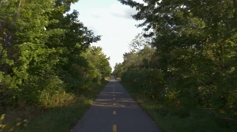 4k - Reverse gimbal shot of a small road Stock Footage 67154109