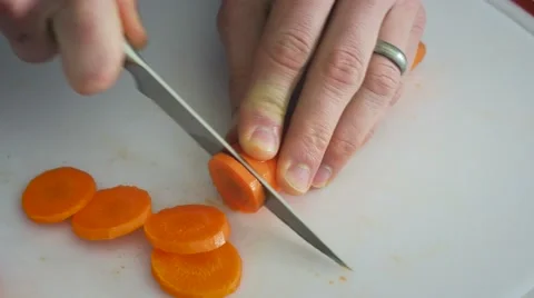 4K - REVERSED carrot slicing Stock Footage 61545448