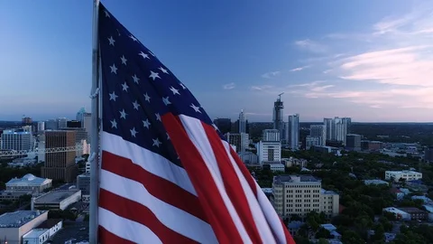 4K Rising Aerial American Flag Austin Sunset Stock Footage