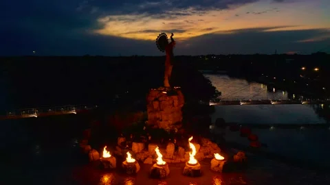 4k rising drone video flames at Keeper of Plains downtown Wichita Kansas Stock Footage 201211309