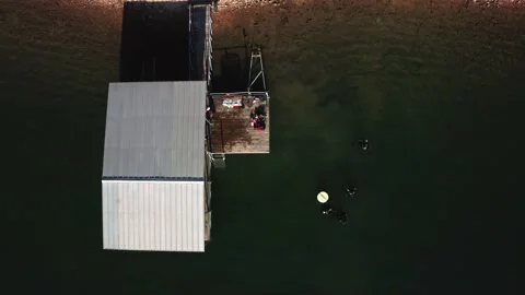 4k Rising overhead drone video scuba divers Beaver Lake Arkansas Stock Footage 170444980