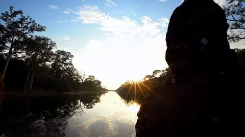 4K, A river with ancient devas statues carved out of stones at Angkor Thom.-Dan Stock Footage 119057086