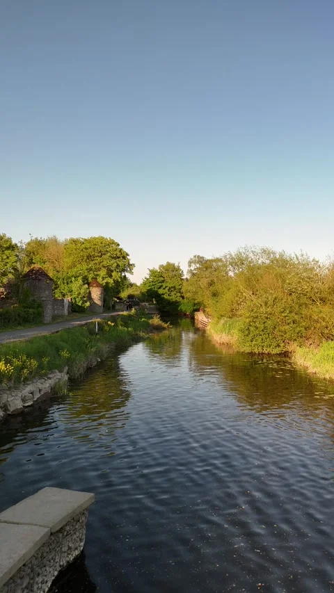 4K River and Stone Wall in Green Countryside Stock Footage 333931726