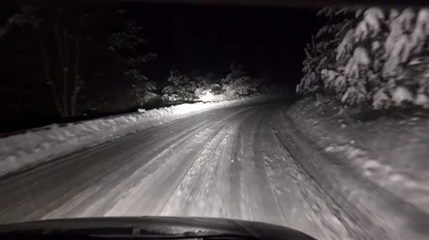 4k riving at night during a heavy snowfall, uhd stock video 스톡 동영상 45706472