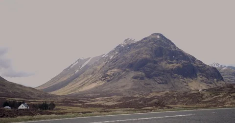 4K A Road through The Glen Coe Scottish Mountains. Cars in a remote area. Stock Footage 93020819