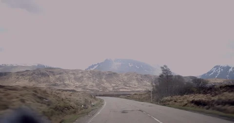 4K Road through The Glen Coe Scottish Mountains. Travellers Beautiful Journey. Stock Footage 93056025