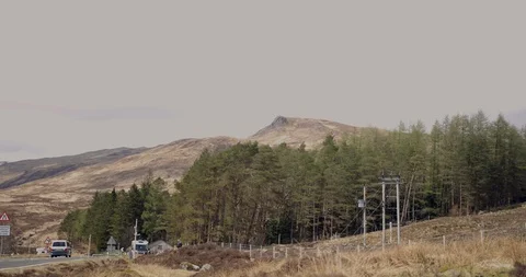 4K Road through The Glen Coe Scottish Mountains. Trees and Mountain destination. Stock Footage 93057030